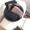 Nude-colored and Slate Grey variety pack displayed in beautiful bowl on the back of the toilet